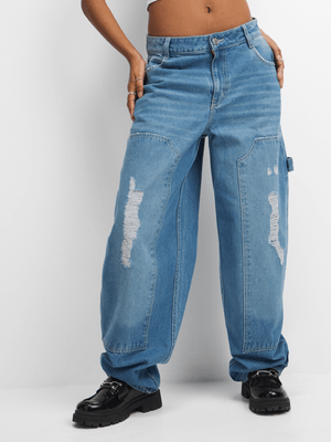 The FIX Women's Light Wash Barrel Rip & Repair Jeans
